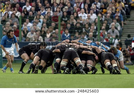 ROME, ITALY-NOVEMBER 13, 2004: all blacks rugby players scrum in action during the rugby test match Italy vs New Zealand, in Rome.