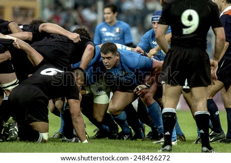 ROME, ITALY-NOVEMBER 13, 2004: italian andrea lo cicero with new zealand rugby players All Blacks in a scrum , during the rugby test match Italy vs New Zealand, in Rome.