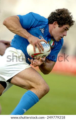 L'AQUILA, ITALY-NOVEMBER 11, 2004: italian rugby player Andrea Masi holds the ball to score a try during the rugby test match Italy vs Canada, in L'Aquila.