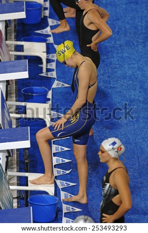 EINDHOVEN, HOLLAND-MARCH 21, 2008: female swimmers on starting blocks during the European Swimming Championship, in Eindhoven.