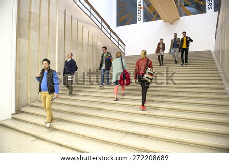 MILAN, ITALY-APRIL 17, 2015: visitors inside the architecture, design and arts museum La Triennale, in Milan.