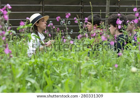 MILAN, ITALY-MAY 04, 2015: school children visiting the green flowers garden and the hive of the British pavillion at EXPO 2015, in Milan.