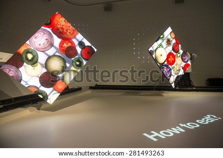 MILAN, ITALY-MAY 04, 2015: robots with multimedia screen displaying food images inside the South Korea pavillion at  EXPO 2015, food is the main topic of this EXPO edition, in Milan.