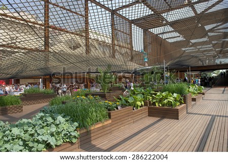 MILAN, ITALY-JUNE 05, 2015: the Brazil pavillion with the elastic rubber pavement and tropical plants at EXPO 2015, in Milan.