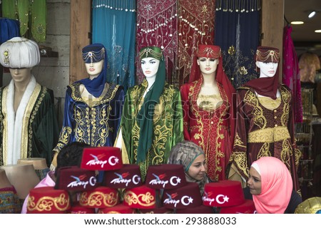 ISTANBUL, TURKEY-MAY 30,2015: turkish traditional hats and dresses in a tourist store of Sutlanahmet in Istanbul.