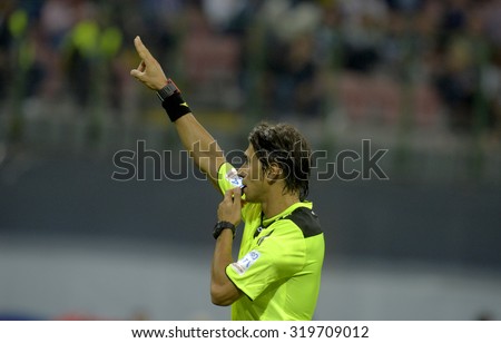 MILAN, ITALY-AUGUST 23, 2015: soccer referee whistles during a soccer match at the San Siro stadium, in Milan.