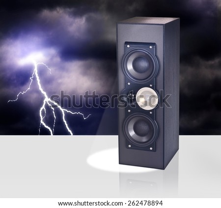 Floor standing loud speaker against night sky with thunderbolt