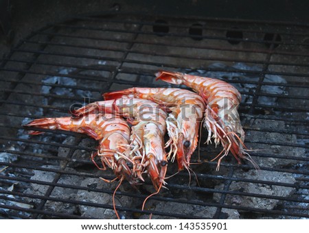 Cooking tiger prawns grilled. Close-up. Background. Outdoor.