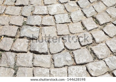 Stone road texture. Cobblestones. Close-up.