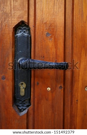 locking handle on the front wooden door
