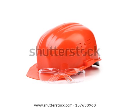Red hard hat and glasses. Isolated on a white background.