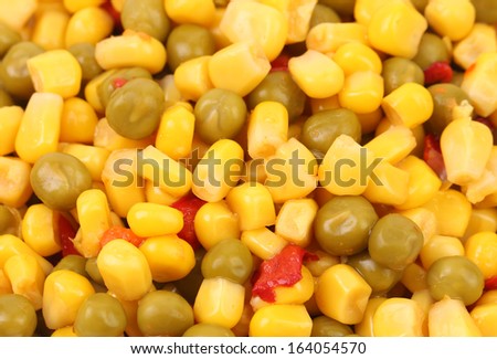 Corn and peas with tomatoes.  Whole background.
