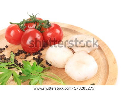 Vegetables on wooden platter. Close up. Whole background.
