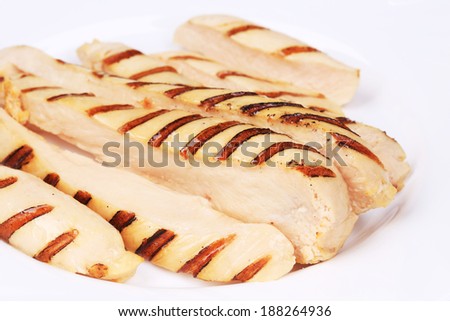 Slices of grilled chicken breast. Isolated on a white background.
