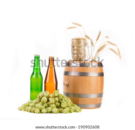 Barrel mug with hops and bottles of beer. Isolated on a white background.