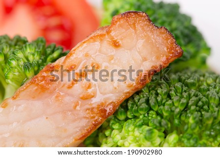 Closeup of broccoli salad with smoked ham.