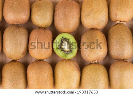 Kiwi fruits cut and whole. Close up. Whole background.
