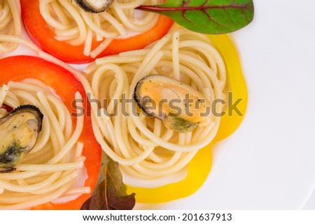 Tasty italian pasta with seafood. Isolated on a white background.