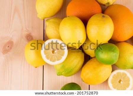 Citrus fruits on the wooden floor. Close up.