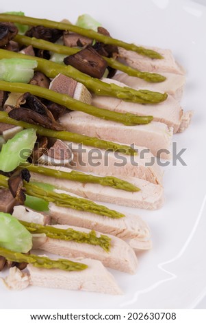 Meat salad with mushrooms. Isolated on a white background.