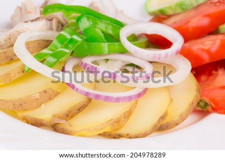 Chicken salad with onion rings close up. Whole background.