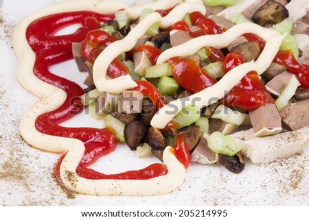 Meat salad with mushrooms. Isolated on a white background.