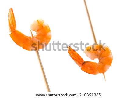 Grilled shrimps on a stick. Isolated on a white background.