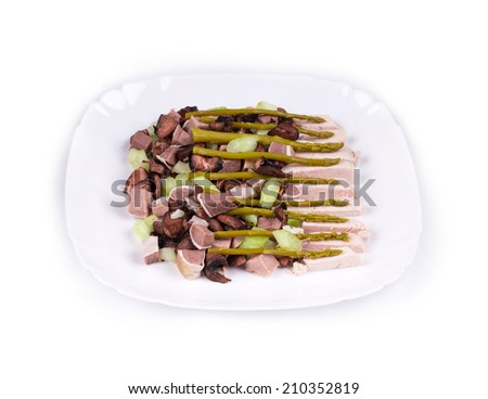 Delicious salad with beef tongue in the closeup isolated