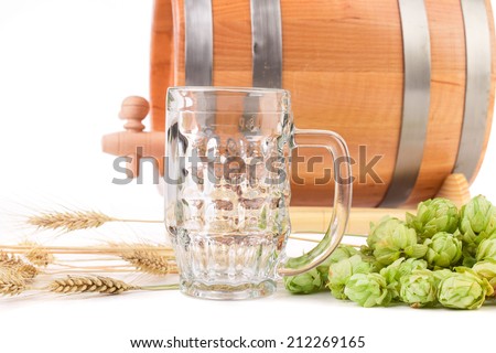 Beer barrel with beer glass and hop. Isolated on a white background.