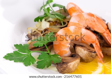Shrimp salad with mushrooms as haute cuisine. Isolated on a white background.