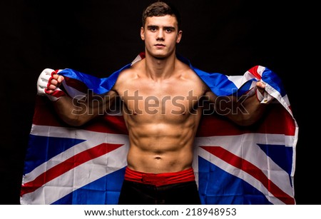 Male model. Kickboxing. Located on the back background.