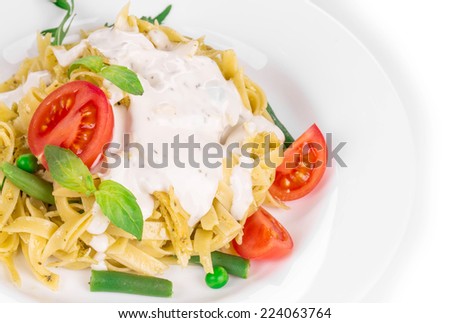 Tasty italian pasta with white sauce. Isolated on a white background.