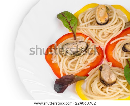 Tasty italian pasta with seafood. On a white background.