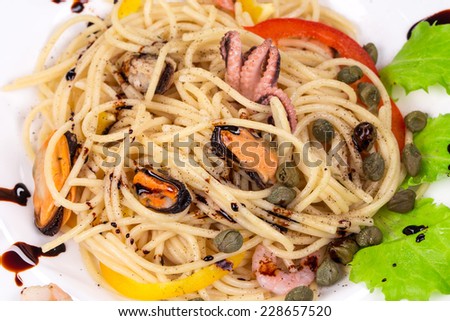 Tasty italian pasta with seafood. Isolated on a white background.