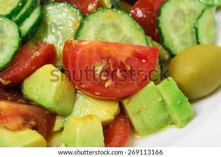 Fresh avocado salad with olives and tomatoes. Can be used as a whole background.