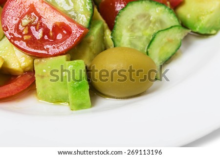 Fresh avocado salad with olives and tomatoes. Can be used as a whole background.