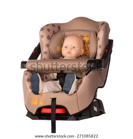Baby doll fastened in a booster seat for car on white background
