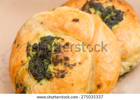 Heat spinach puff cakes in cardboard box. Macro. Can be used as a whole background.