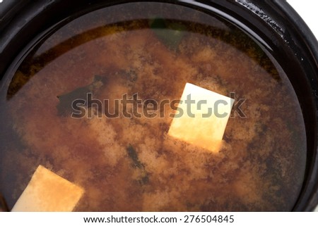 Closeup of delicious vegetable soup with tofu. Macro. Can be used as a whole background.