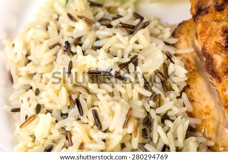 Delicious basmatic rice with grilled chicken fillet. Macro. Photo can be used as a whole background.
