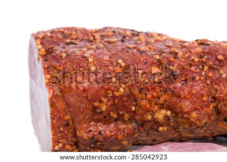 Delicious smoked pork ham with spices. Macro. Isolated on a white background.