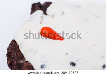 Delicious beef steak covered with mushroom sauce. Macro. Photo can be used as a whole background.