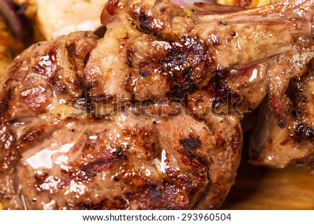 Delicious grilled lamb racks. Macro. Photo can be used as a whole background.