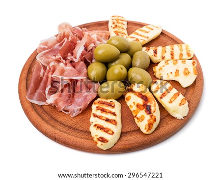 Italian prosciutto and fried mozzarella sticks with olives platter as a starter in restaurant. Isolated on a white background.
