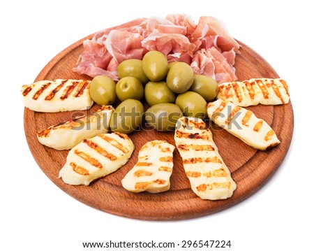 Italian prosciutto and fried mozzarella sticks with olives platter as a starter in restaurant. Isolated on a white background.
