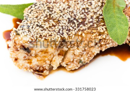 Perch fillet with tomato and avocado salsa covered with sesame seeds. Macro. Photo can be used as a whole background.