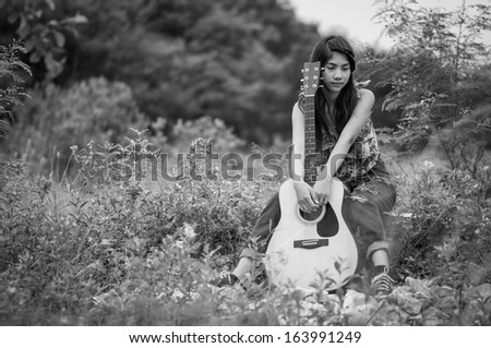 Musician woman and her guitar in good day