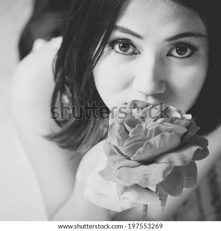 Glamorous young woman and her flower, Black & White image