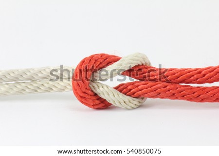 Red and white string knotted on a white background.
