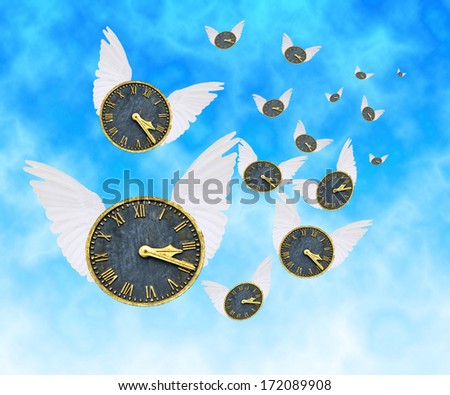 Time Flies.  Digitally created image of multiple clocks with wings flying against a blue sky background.